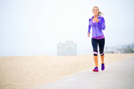 Photo for Portrait, space or happy woman at beach running for exercise, training or fitness workout at sea. Sports person, runner and healthy female athlete on road for cardio endurance, wellness and mockup. - Royalty Free Image