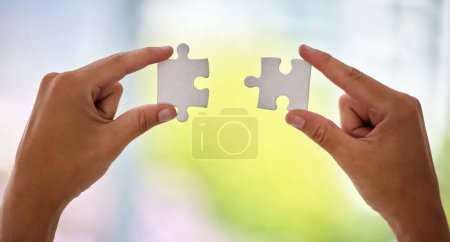 Photo for Hands, puzzle and office for business solution with connection, synergy or integration at company. Person, toys and creativity for problem solving, strategy or link with ideas for vision in workplace. - Royalty Free Image