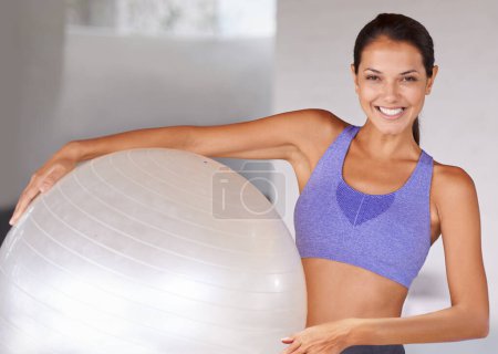 Photo for Happy woman, portrait and fitness with ball for workout, health and wellness at home. Face of female person or yogi with smile for gym equipment, training or pilates in sports or wellbeing at house. - Royalty Free Image