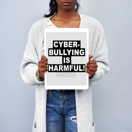 Screen, information and woman with tablet in studio for cyberbullying, activism or security. Digital banner, poster and person with tech for social media, online safety and privacy on gray background.