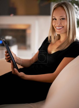 Photo for Happy, portrait and woman with tablet on sofa for social media, streaming or web, search and communication at home. Digital, app or face of female person with google it, sign up or Netflix and chill. - Royalty Free Image