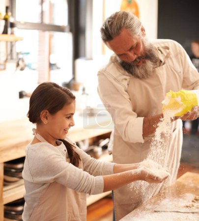 Photo for Girl, kid or grandfather with flour in kitchen for cooking, baking or teaching with support or helping. Family, senior man or grandchild with dough or cake preparation in home for bonding or learning. - Royalty Free Image