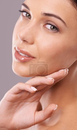 Photo for Skincare, portrait and hands on face of woman for wellness, beauty and facial care for spa aesthetic. Luxury salon, dermatology and person with makeup, cosmetics and smile on studio background. - Royalty Free Image