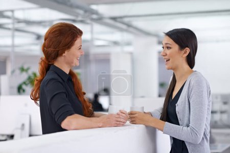 Photo for Business women, coffee break and happy in office for gossip, story and laugh with partner. Work friends, smile and listening with drink, latte and conversation to start morning in corporate workplace. - Royalty Free Image