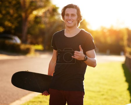 Smile, portrait and skateboarder with shaka hand gesture outdoor for hobby, skill practice and cruising. Male person, happy and hang loose in summer for urban fun, freedom and extreme sports.
