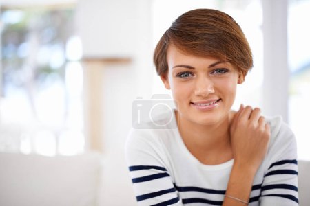 Photo for Happy, portrait and woman relax with beauty in home on sofa in lounge with makeup on vacation or holiday. Calm, break and girl with smile for skincare or cosmetics in apartment in living room. - Royalty Free Image