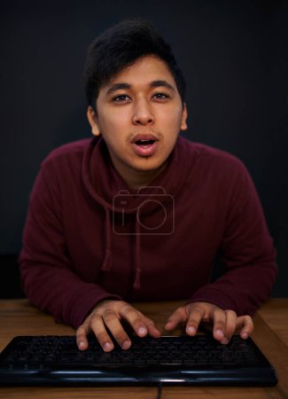 Photo for Man, face and keyboard for coding, programmer and information technology with video game or software development. Internet, computer programming and portrait, gamer or developer for cyber security. - Royalty Free Image