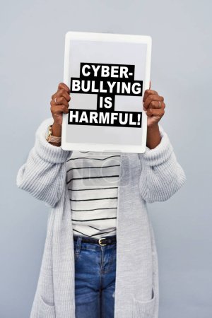 Advertising, screen and woman with tablet in studio for social media, cyberbullying or activism. Digital poster, banner and person with tech for online safety, security and privacy on gray background.