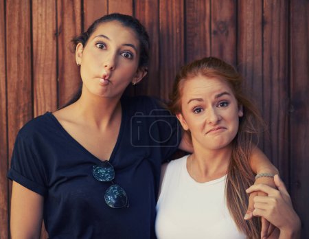 Photo for Portrait, funny face and woman friends on wooden background together for bonding or relationship. Love, comedy or humor and happy young people having fun summer for holiday, vacation and getaway. - Royalty Free Image