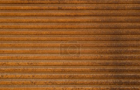 Photo for Rust, metal and roller door for garage, construction and old for water damage and iron oxide. Texture, exterior or distress steel for maintenance and gate or security, shutter and outside or metallic. - Royalty Free Image