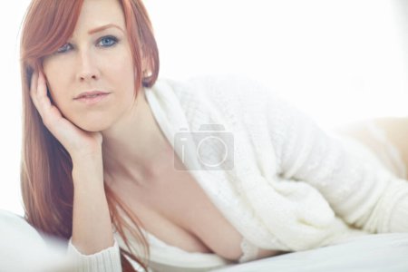 Lingerie, cardigan and portrait of woman, bedroom and confidence in underwear, mockup and break in home. Weekend, fashion and loungewear for girl, morning and model with pride on bed and jersey.