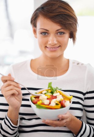 Photo for Woman, salad and healthy food in portrait for diet with detox, breakfast and lunch at home. Young person eating vegetables, lettuce and green fruit or vegan meal in bowl for nutrition and wellness. - Royalty Free Image