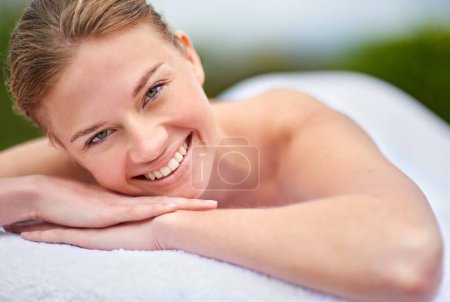 Photo for Spa, happy woman and portrait on massage bed for wellness, beauty treatment or body care. Smile, relax and female person at luxury resort for stress relief, comfort or pamper on tropical holiday. - Royalty Free Image