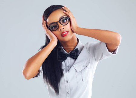 Photo for Funny, face and woman in studio confused with fashion of nerd or geek on background, mockup or space. Crazy, girl and student with glasses overwhelmed in college or academy with puzzle or question. - Royalty Free Image