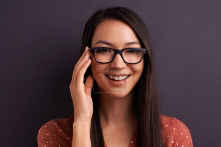 Photo for Portrait, optometry and woman with glasses, happiness or person on grey studio background. Face, model or girl with eyewear or mockup space with smile, joy or iris with sight or see with clear vision. - Royalty Free Image