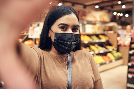 Photo for Woman, selfie and face mask in supermarket for grocery shopping update, vlog and content creation in South Korea. Girl or tourist in portrait photography by food and vegetables with experience abroad. - Royalty Free Image