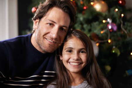 Photo for Christmas, family and portrait of father with girl in home for celebration, festival and season event. Face of happy dad and child bonding, relax and embrace for holiday, vacation and festive party. - Royalty Free Image