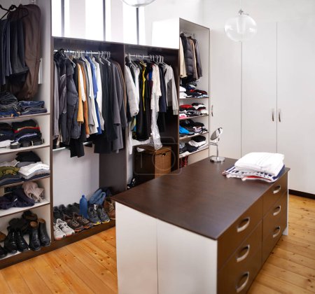 Photo for Closet, home and clothes with interior design apartment luxury for walk in wardrobe, empty room or hanging. Storage, drawers and fashion organization in house or dressing room, furniture or shelves. - Royalty Free Image
