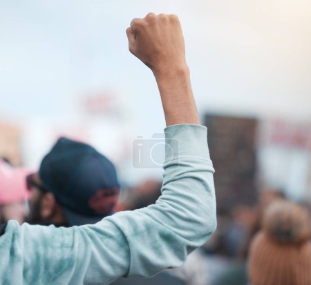 Photo for Person, hand and fist for protest, social justice and group demonstration for civil rights and freedom. People, politics and objection gesture to government or state for change or progress in society. - Royalty Free Image