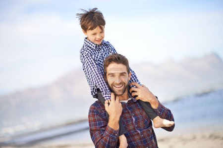 Photo for Ocean, portrait and man with child on shoulders, walking and smile on outdoor bonding adventure. Nature, father and son at beach for travel, trust and holiday together with support, love and growth - Royalty Free Image