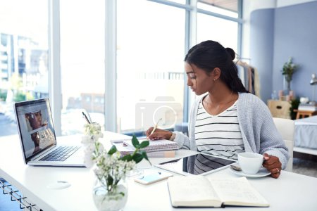 Photo for Girl, laptop and student writing in home, study and learning workspace in bedroom for online elearning. Notebook, tech for internet search or social media, coffee and serious and tablet for notes. - Royalty Free Image