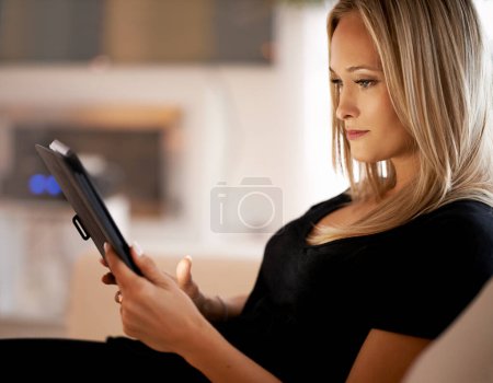 Photo for Search, tablet and woman on sofa with internet, scroll or social media, ebook or streaming at home. Digital, app or female person in a living room online with google it, sign up or netflix and chill. - Royalty Free Image