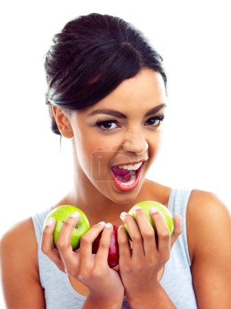 Photo for Portrait, excited and woman with apple, nutrition and sustainable eating to lose weight in studio. Fruit, face and girl with fresh food for detox diet, vitamins and gut health on white background - Royalty Free Image