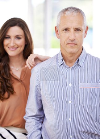 Photo for Couple, portrait and smile in home for love with support, trust and pride in living room of house. Senior man, woman and face with confidence for embrace, comfort or healthy relationship in apartment. - Royalty Free Image