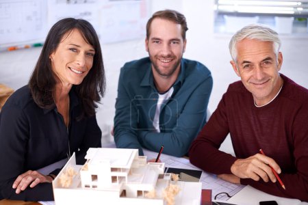 Photo for Portrait, architects and teamwork with building model, design and development with colleagues. Smile, remodeling and construction in office for meeting, contractor or property developer for project. - Royalty Free Image