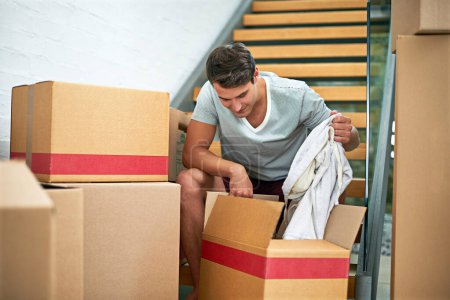 Man, moving and boxes in new house with check, inspection or fresh start with investment in real estate. Person, cardboard and package on steps, unpacking or home with for rent, mortgage or property.