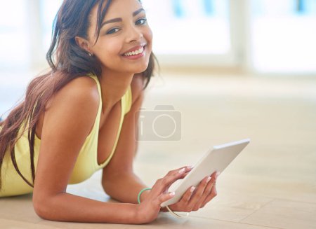 Photo for Portrait, young woman and tablet on floor with happy for connectivity, streaming or online shopping. Female person, technology and smile for social media, e learning and gaming in chat or texting. - Royalty Free Image
