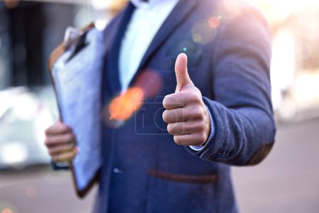 Photo for Clipboard, checklist and thumbs up from inspector with hands to show compliance, approval or ok sign. Yes, agreement and professional success on site with inspection, review and opinion feedback. - Royalty Free Image