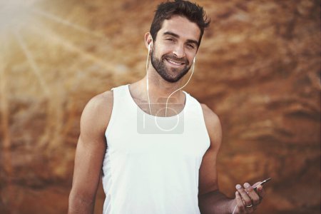 Photo for Fitness, headphones and portrait of man with phone for training, exercise and music for workout. Male person, earphones and face with happiness for online streaming, podcast and morning cardio. - Royalty Free Image