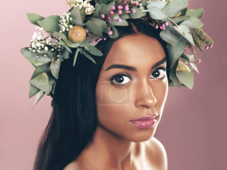 Photo for Indian woman, portrait and flower or crown for beauty on pink background, sustainability or eco friendly. Female person, face and wreath for organic skincare or dermatology, studio or mockup space. - Royalty Free Image
