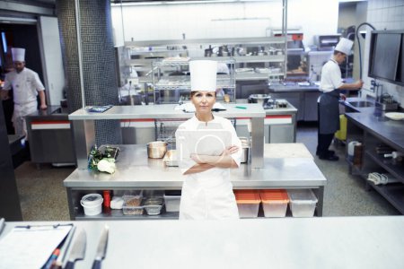 Chef, crossed arms and portrait of woman in kitchen of restaurant for meal, dinner or lunch. Hospitality, career and professional culinary worker with confidence for catering in fine dining diner