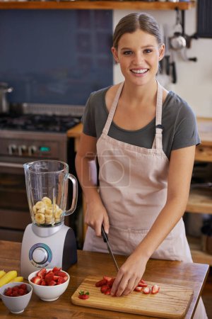 Photo for Woman, portrait and fruit smoothie in kitchen for weight loss nutrition, healthy or vitamins. Female person, face and knife with cutting board for juicer shake or blender, ingredients or preparation. - Royalty Free Image