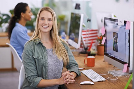 Photo for Portrait, happy and business woman by computer in office, closeup and professional for connectivity by desk. Graphics designer, smile and face by desktop for digital editing and creative at workplace. - Royalty Free Image