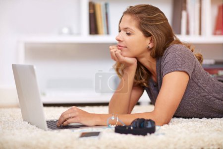 Photo for Laptop, student and woman on floor for elearning, education and studying in home living room. Typing, online lecture and learning for university on carpet, female person and relax for course work. - Royalty Free Image