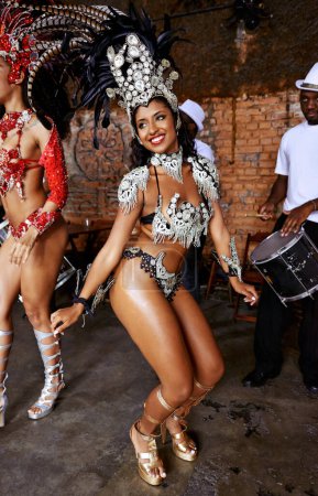 Photo for Women, samba dancer and smile at carnival, stage and band with fashion, culture and creativity in nightclub. Girl, people and dancing with music, drums and tradition for celebration in Rio de Janeiro. - Royalty Free Image