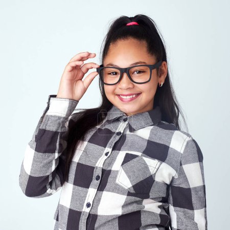 Photo for Studio, glasses and portrait of girl with eye care for clear vision, wellness and optometry. Kid, spectacles and smile of child with happiness for eyesight, pride and confidence on white background. - Royalty Free Image
