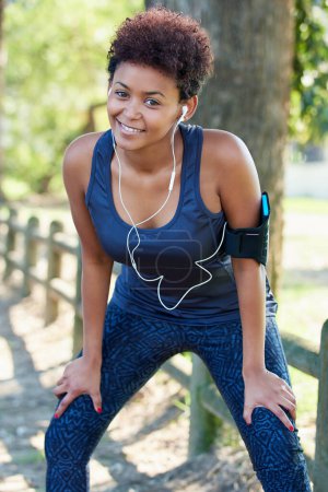 Photo for Portrait, woman and fitness with woods, outdoor and exercise for workout, training and wellness. Female athlete, armband and nature in sports, physical activity and smile in forest with earphones. - Royalty Free Image