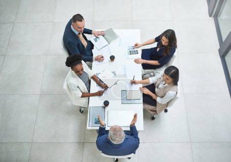 Photo for From above, business people or discussion in office meeting for partnership, collaboration or corporate deal. Workplace, boardroom or team with documents for agreement, project or working. - Royalty Free Image