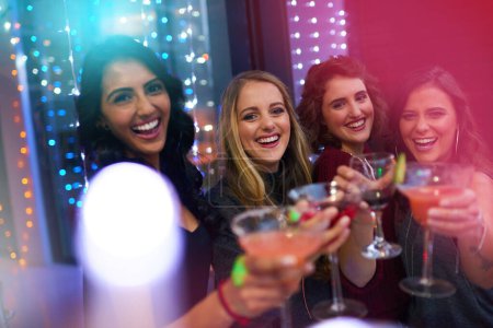 Photo for Women, friends and cocktail party with toast for portrait at nightclub, event and happy hour. People, club and drink with group, alcohol and smile with celebration for new year with cheers in night. - Royalty Free Image
