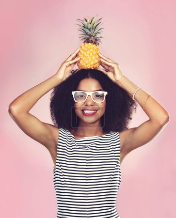 Photo for Studio, portrait and black woman with pineapple, diet and detox on pink background. Health, nutrition and gut digestion for weight loss and vitamins for female model, vegan and vitamin c for fiber. - Royalty Free Image