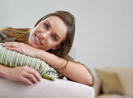 Photo for Happy, portrait and girl on sofa to relax for comfort or rest on Saturday afternoon, peace and unwind. Female person, calm and couch to lounge in living room for serenity, mindfulness and wellness - Royalty Free Image