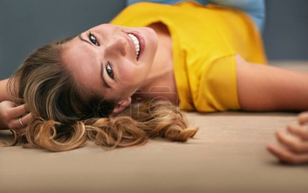 Photo for Portrait, smile and woman on ground, happiness and relaxing with confidence, home and peaceful. Face, person and girl on floor, joyful and calm thoughts with mindset, chilling and carefree weekend. - Royalty Free Image