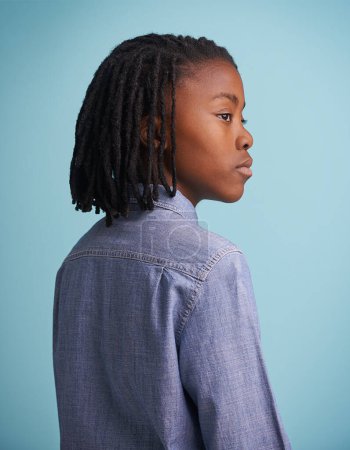 Photo for Thinking, idea and black boy kid in studio with why, questions or memory on blue background. Planning, child development and African teen model with vision for solution, problem solving or reflection. - Royalty Free Image