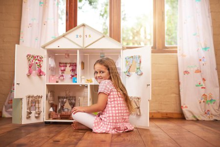 Photo for Portrait, girl and dollhouse in bedroom for happiness, play and childhood development on holiday in home. Smile, female child and having fun on floor for creativity, education and toys for vacation. - Royalty Free Image