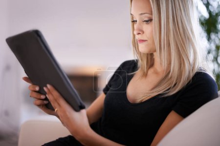 Photo for Tablet, search or calm woman on sofa with internet, scroll or social media, ebook or streaming at home. Digital, app or female person in living room online for google it, sign up or Netflix and chill. - Royalty Free Image