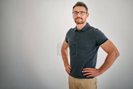 Photo for Businessman, portrait and smile in studio with grey background, relax and confidence of employee or staff. Creative, designer and male person, startup and worker with pride, company and model in job. - Royalty Free Image